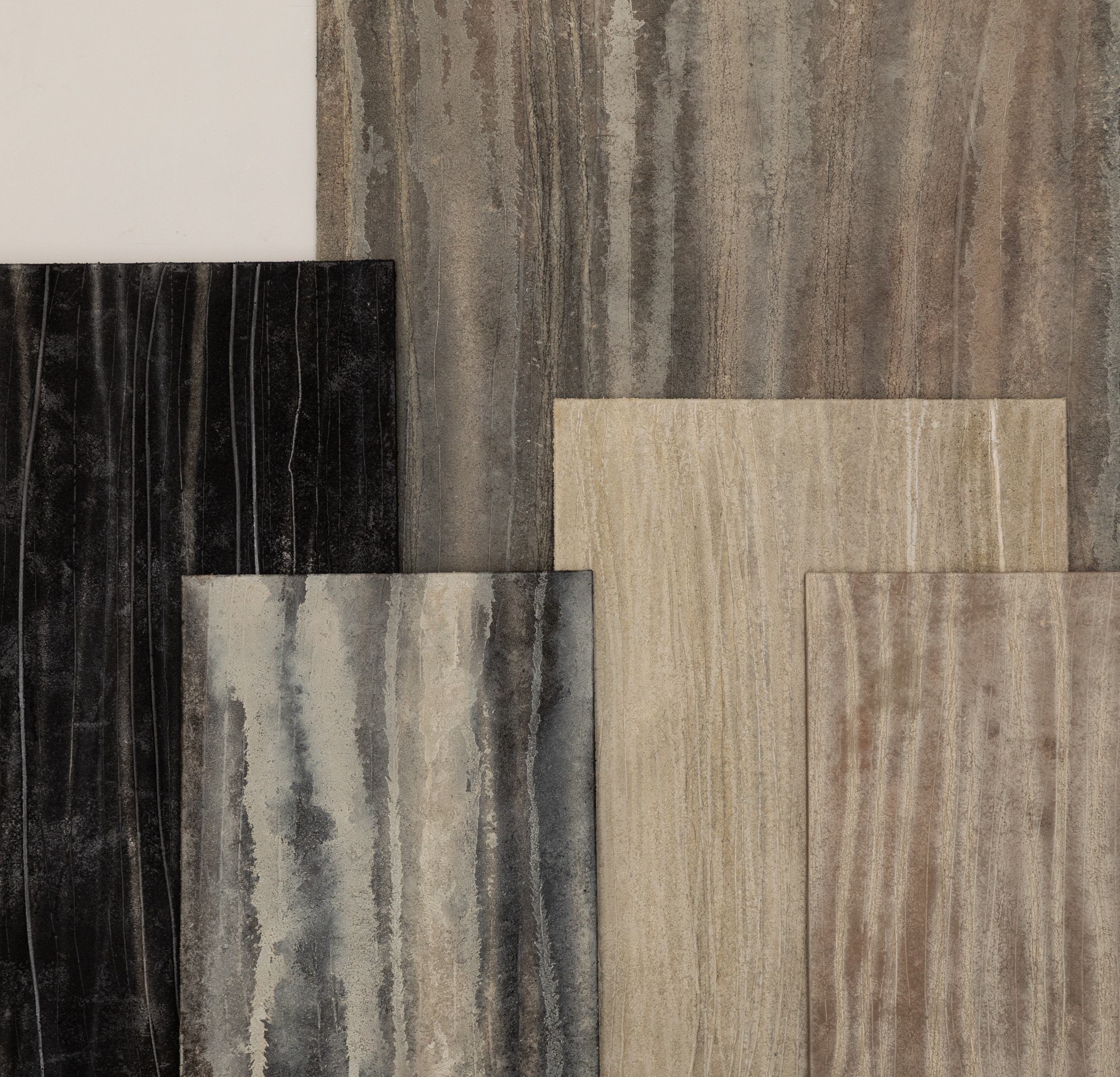 Layered abstract panels with vertical streaks in earthy tones of black, beige, and gray.